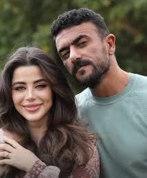 أحمد العوضى ويارا السكرى